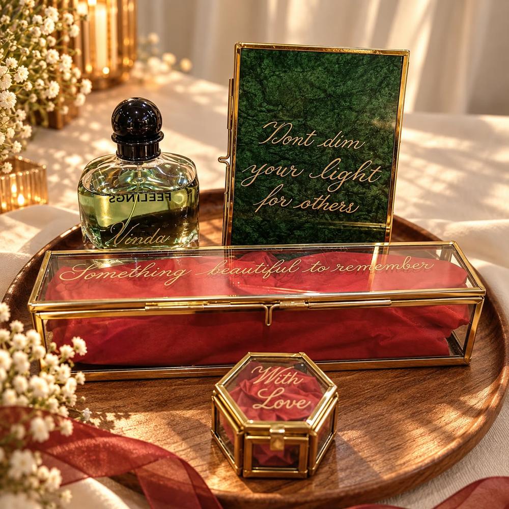 Glass gift set and bottle engraved with calligraphy messages on a gold tray