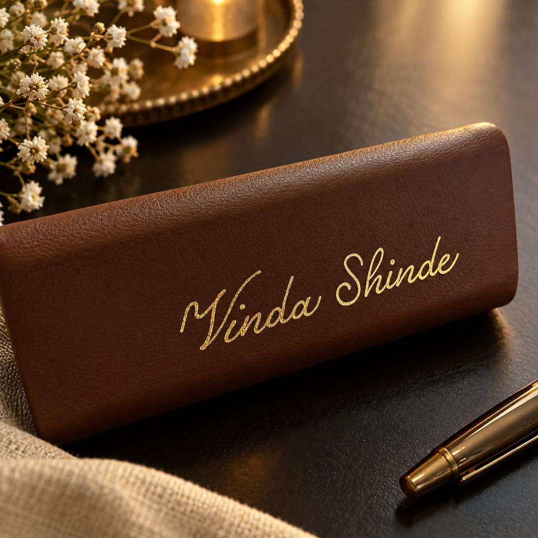 Brown leather pen case personalised with the name Vinda Shinde in gold heat foil calligraphy